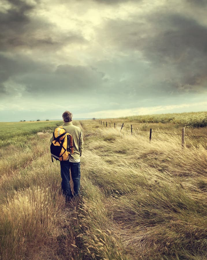 Man Walking Down Country Road Stock Photo Image of baggage, prairie