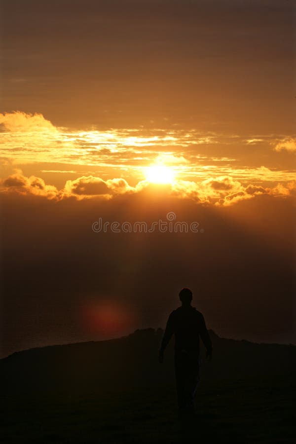 Man walking off into sunset