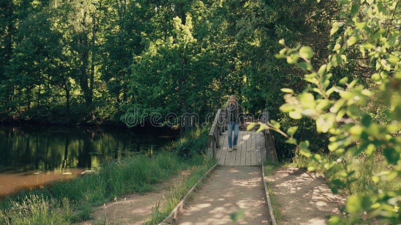 A man walks in the Park on a summer day.