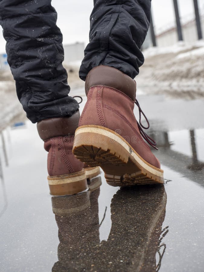 A Man Walks through a Puddle in Terracotta Leather Shoes. Close-up ...