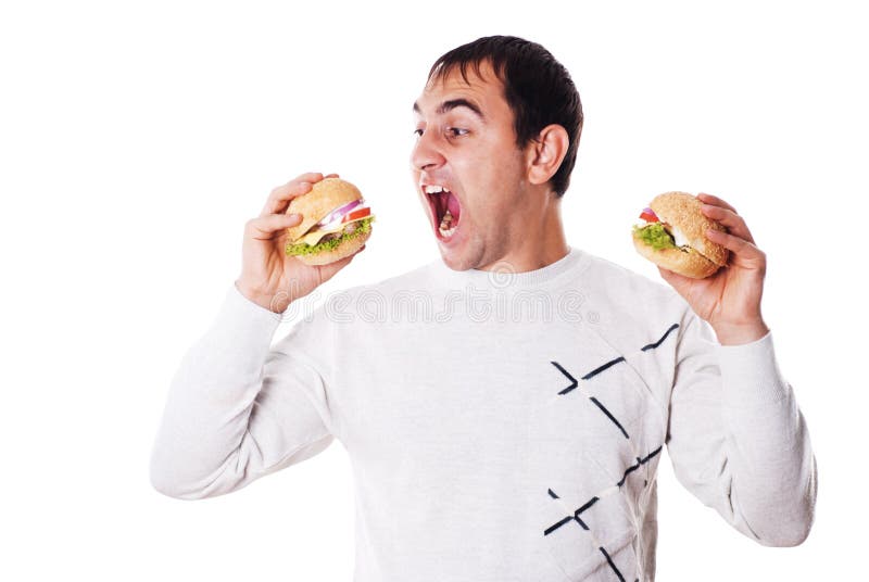 Young Man Eating a Freshly Made Sub Meat Feast San Stock Photo