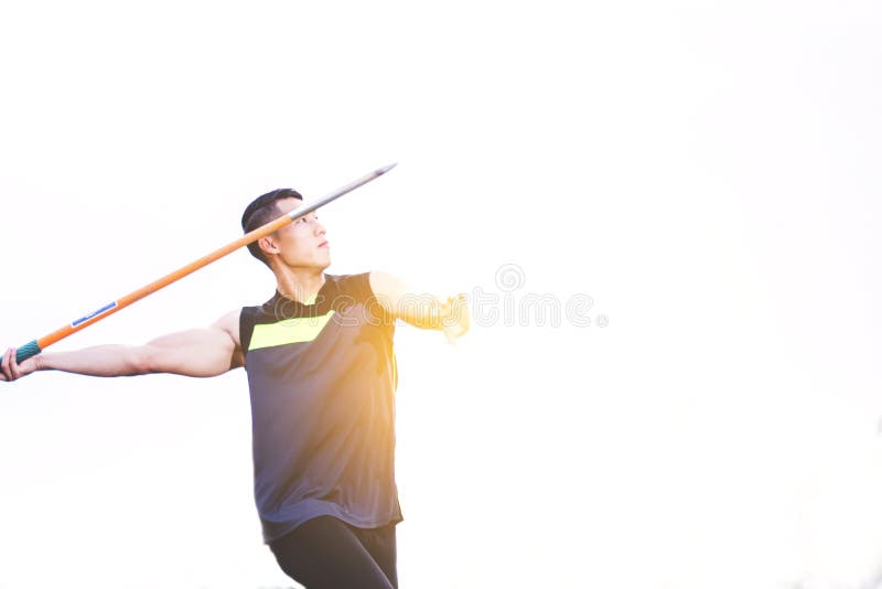 Man Warming Up and Practicing Javelin Throw in Yard Stock Photo Image