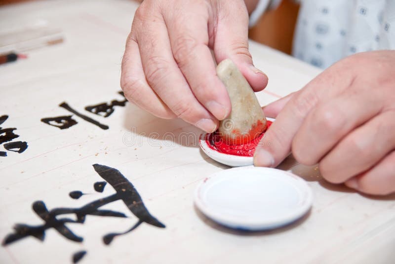 A man was writing Chinese calligraphy