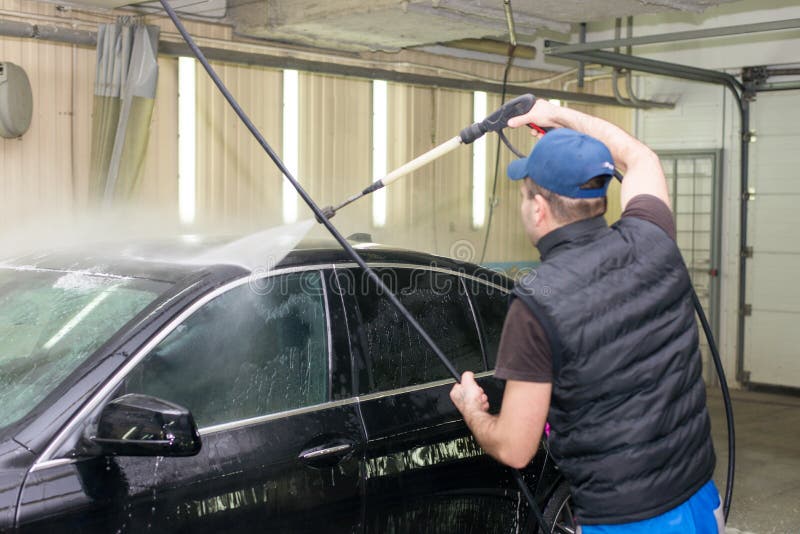 A man washes a black car stock image. Image of detail 90650255