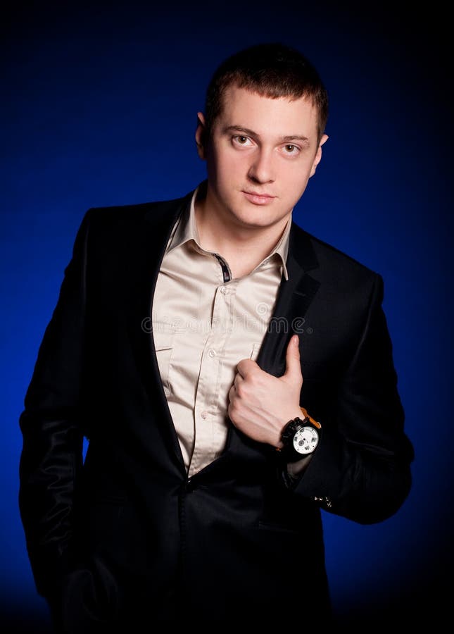 Man with watch on a blue background