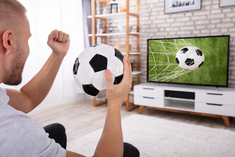 Man Watching Football Match On Television. 