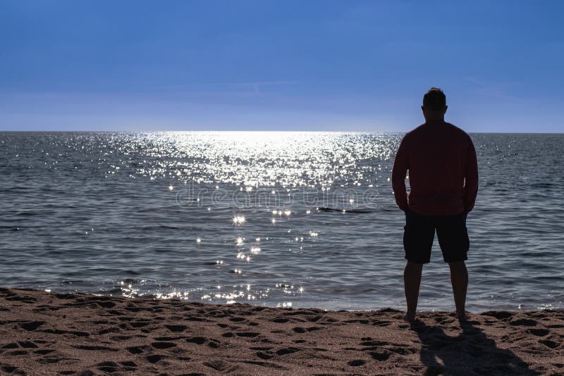 Man Watching the Sunrise on a Beach in Spain Stock Photo Image of