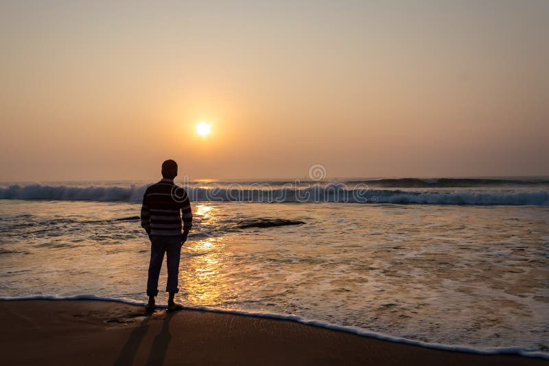 A man watching sunrise in sea beach from Digha popular spot of westbengal
