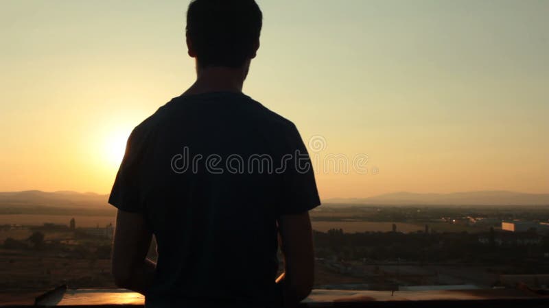 Man watching sunset stock video footage Man watching sunset stock video footage