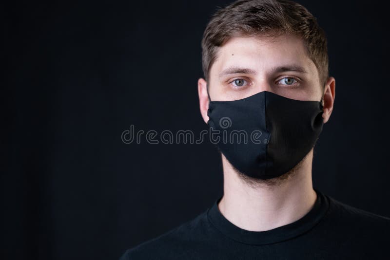 Man wearing black face mask. Pandemic coronavirus covid-19 quarantine period concept.