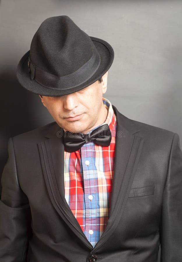 Man Wearing a Black Suit and Bow Tie on Gray Stock Photo Image of model, fashionable 73404696