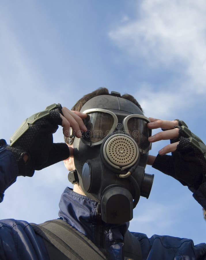 Man wearing gasmask stock photo. Image of mask, adjusting 11105464