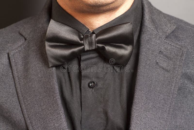 Man Wearing A Gray Suit And Black Bow Tie Stock Photo Image of