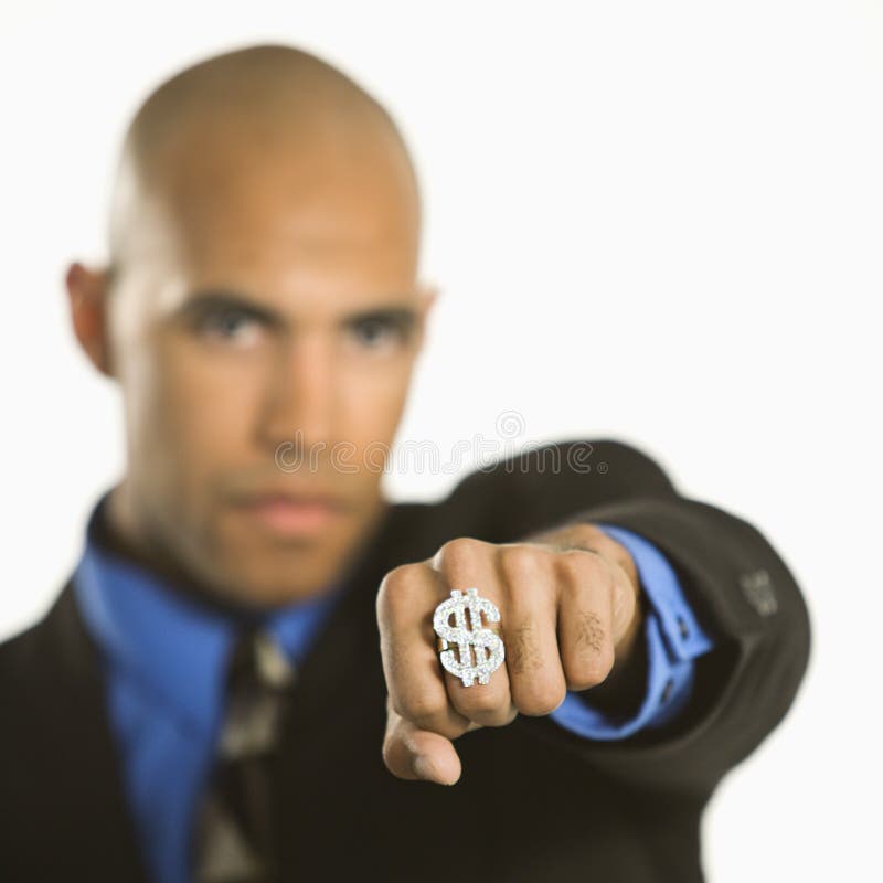 African American man wearing ring with money sign. African American man wearing ring with money sign.