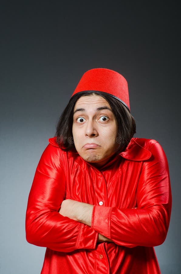 Man wearing red fez hat stock image. Image of perplexed 62464837