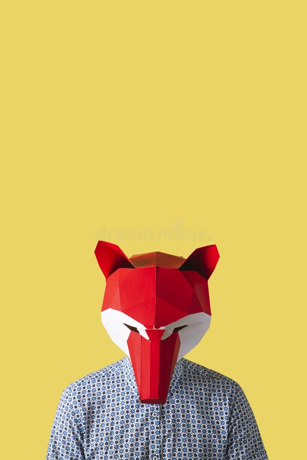 Man Wearing a Red Fox Mask on a Yellow Background Stock Image Image