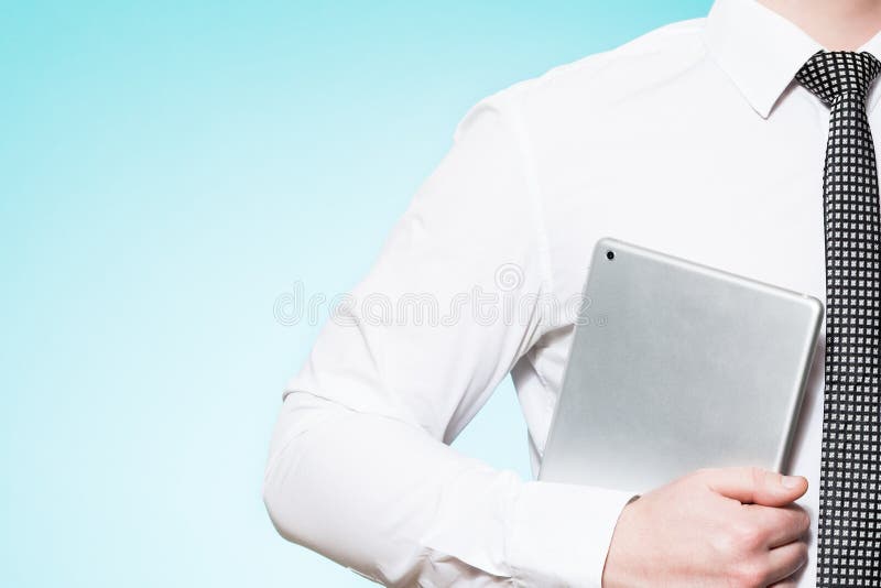 Man wearing shirt and tie with tablet pc