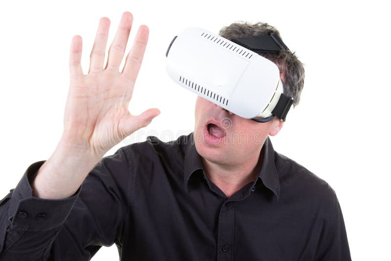 Man wearing white virtual reality headset having great fun royalty free stock image