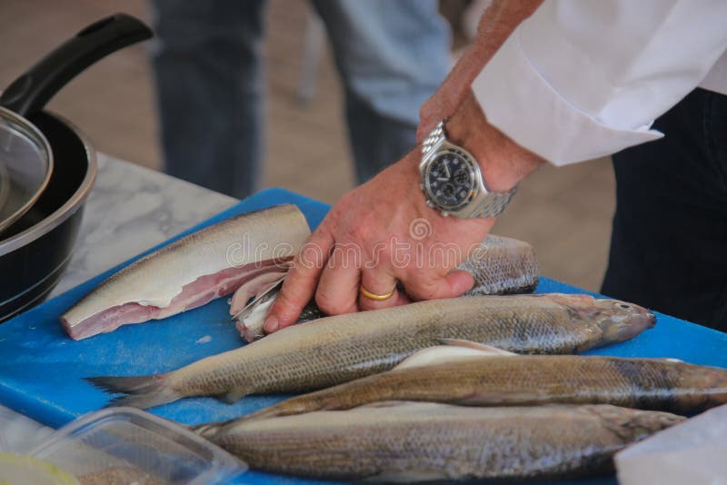 Man`s Hand Clean Fish on Board. Stock Image Image of fishing, hand