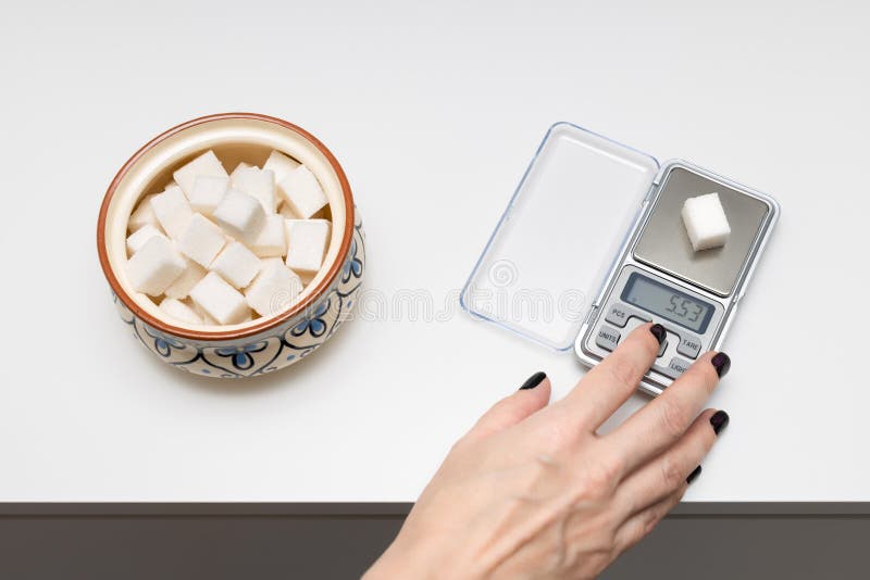 https://thumbs.dreamstime.com/b/man-weighing-cube-sugar-small-scale-woman-scales-items-counting-calories-healthy-lifestyle-273940428.jpg