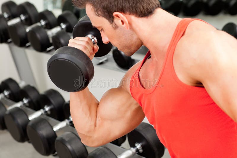 Man with weight training equipment on sport gym royalty free stock photography Man with weight training equipment on sport gym royalty free stock photography