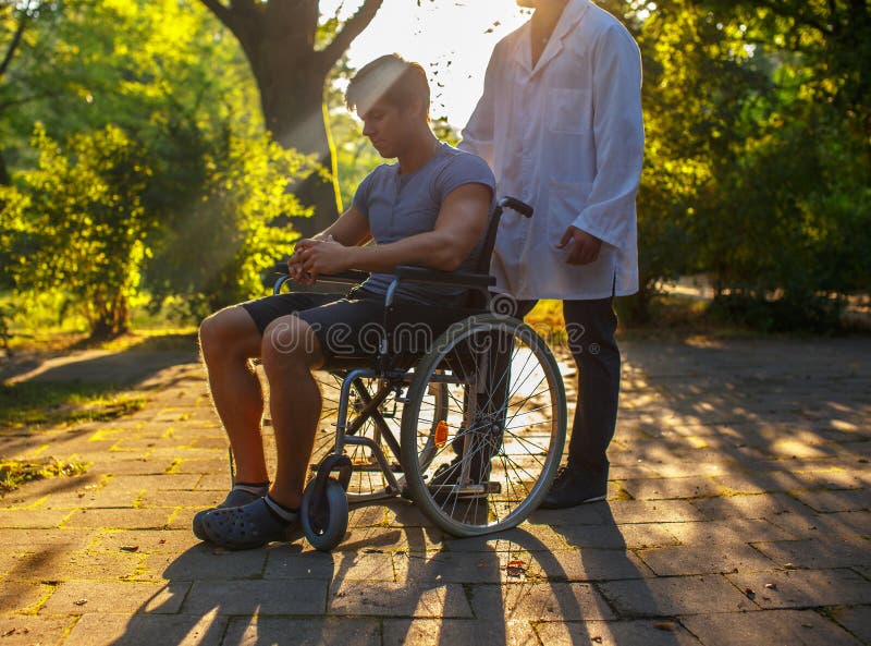 Man in Wheelchair and His Doctor Stock Image Image of medicine, service 108601455