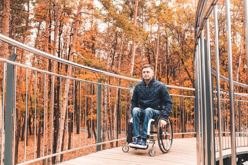 Man in a Wheelchair Use a Wheelchair Ramp. Stock Image Image of disease, care 133169371