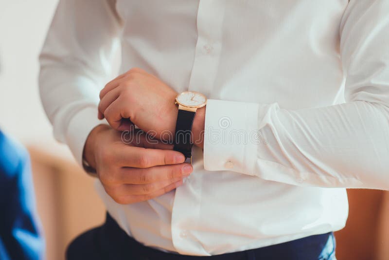 The Man In The White Shirt In The Window Wears Watches Stock Photo