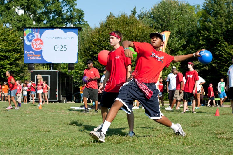 Man Winds Up To Throw In Outdoor Dodge Ball Game