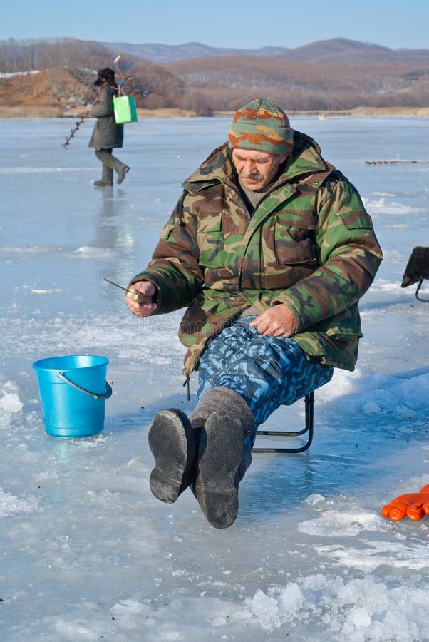 Man on winter fishing 44