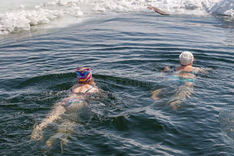 A man - a winter swimmer, swimming in the winter hole stock photos A man - a winter swimmer, swimming in the winter hole stock photos