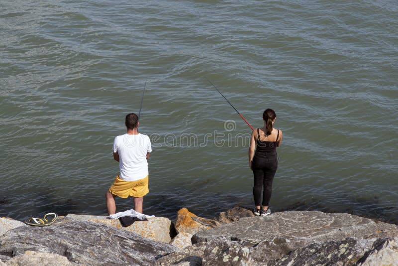 Angling at the water`s edge royalty free stock photography Angling at the water`s edge royalty free stock photography