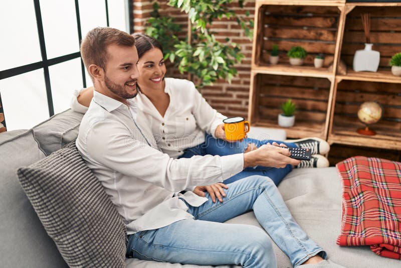 Man and Woman Couple Drinking Coffee Watching Tv at Home Stock Image ...