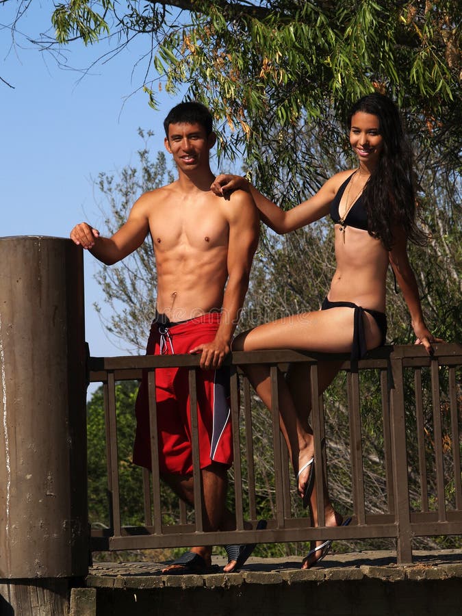 Young Attractive Couple Outdoors Swim Suit Smiling. Young Attractive Couple Outdoors Swim Suit Smiling