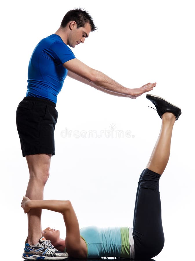 Man and woman doing abdominals workout push ups