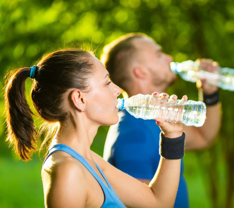 Woman drinking from water bottle Stock Photo by ©photography33 8689824