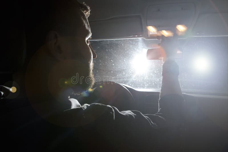 The man and woman drive a car in emergency situation. evening night time royalty free stock photography The man and woman drive a car in emergency situation. evening night time royalty free stock photography