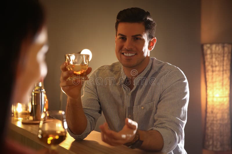 Man and woman flirting with each other in bar