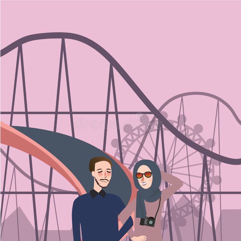 Man woman in front of roller coaster take photo having fun couple Islam wearing veil