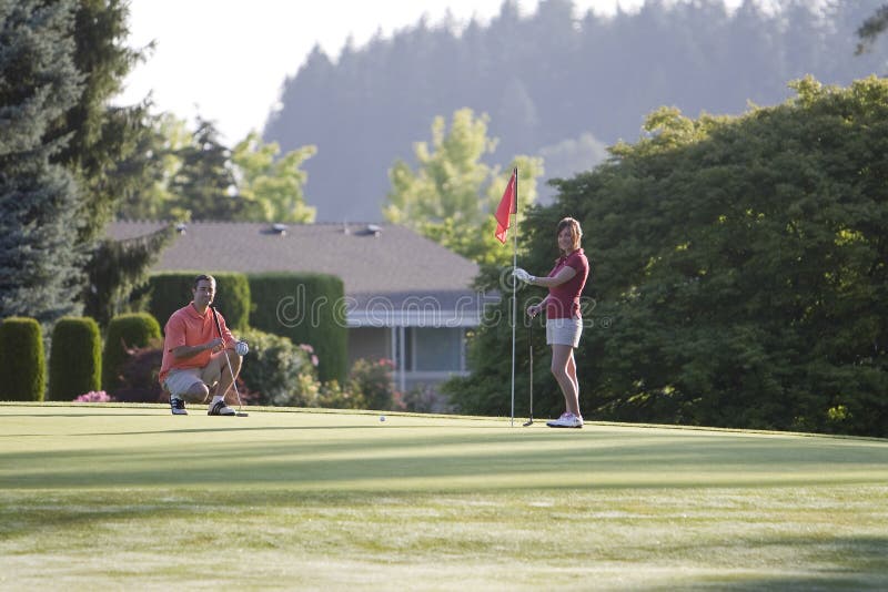 Man and Woman on Golf Course - Horizontal