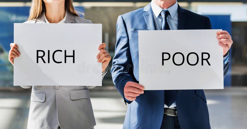 Man and woman holding white placard with RICH and POOR sign royalty free stock images Man and woman holding white placard with RICH and POOR sign royalty free stock images