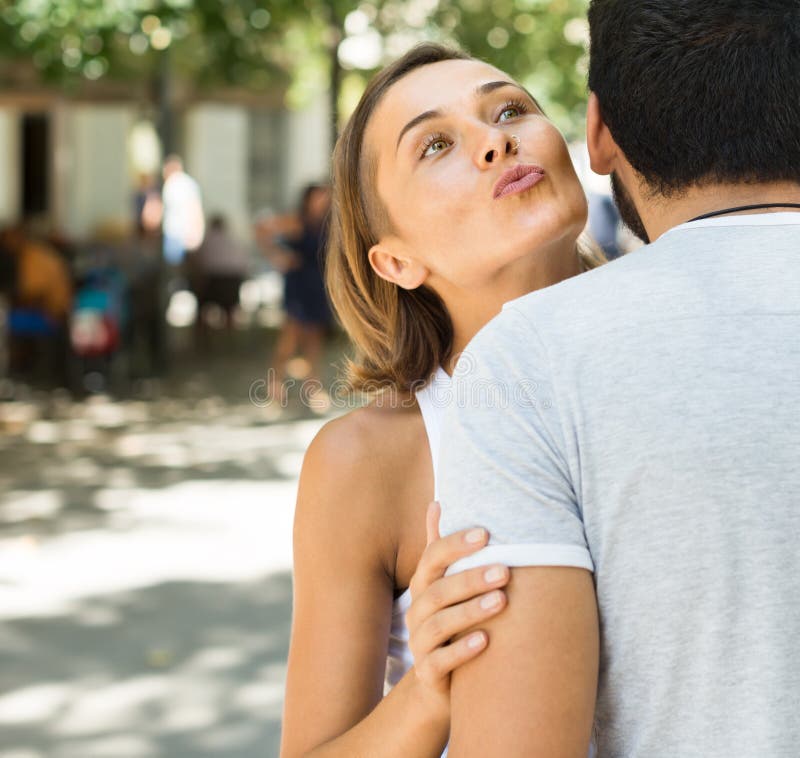 Girlfriend kissing petite street