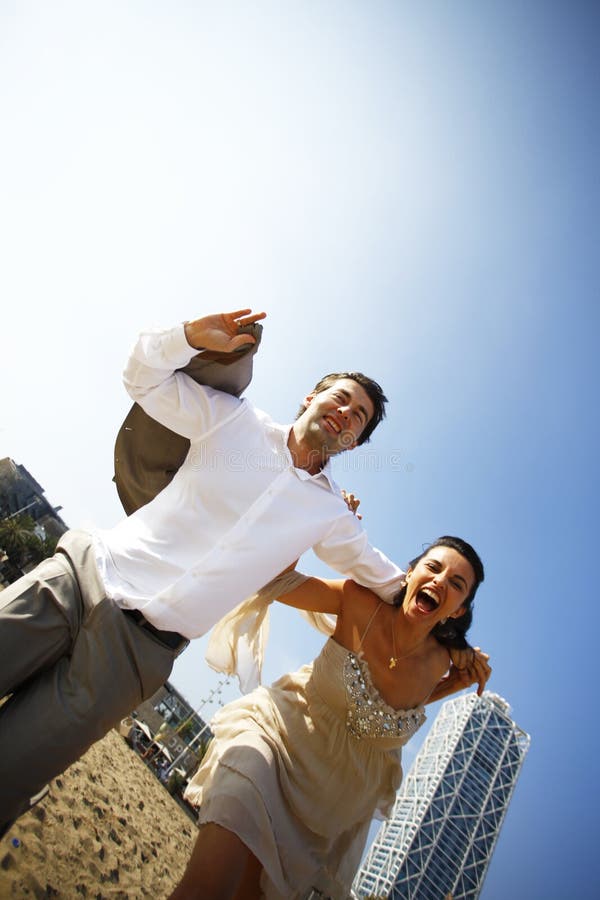 Man and woman running on beach