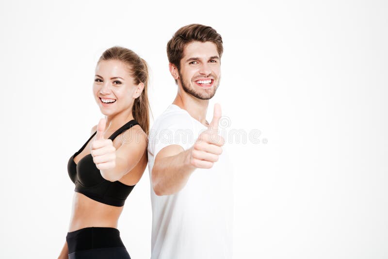 Man and woman showing thumbs up gesture stock image Man and woman showing thumbs up gesture stock image
