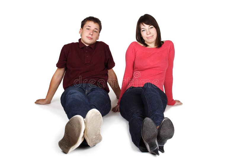 Man and woman sitting on floor, front view