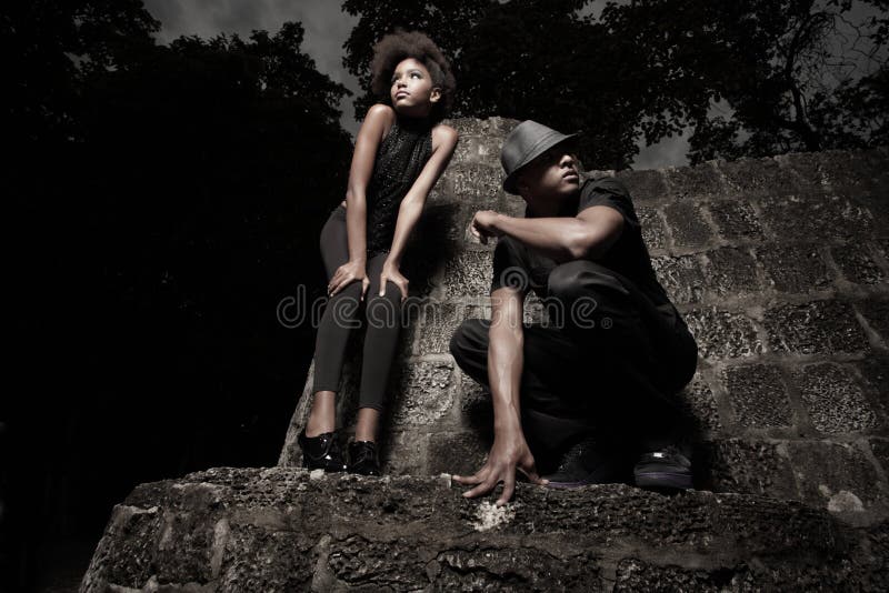 Man and woman on a stone wall