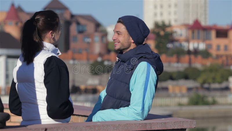Man and woman talking before jogging