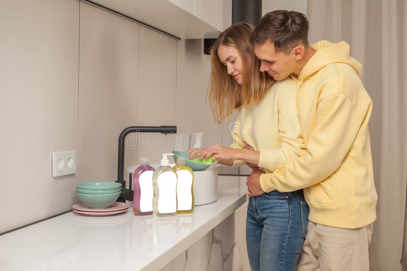 Man and Woman Washing the Dishes Using Dishwashing Liquid with Blank