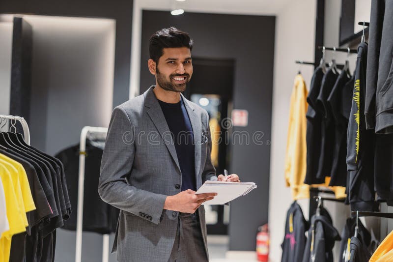 Man Working in Clothing Store Stock Photo Image of buying, selling