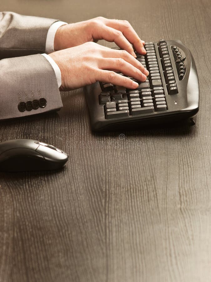 Man working with a keyboard and a mousse royalty free stock image Man working with a keyboard and a mousse royalty free stock image